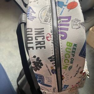 It's a beautiful white Pixar bag full of characters